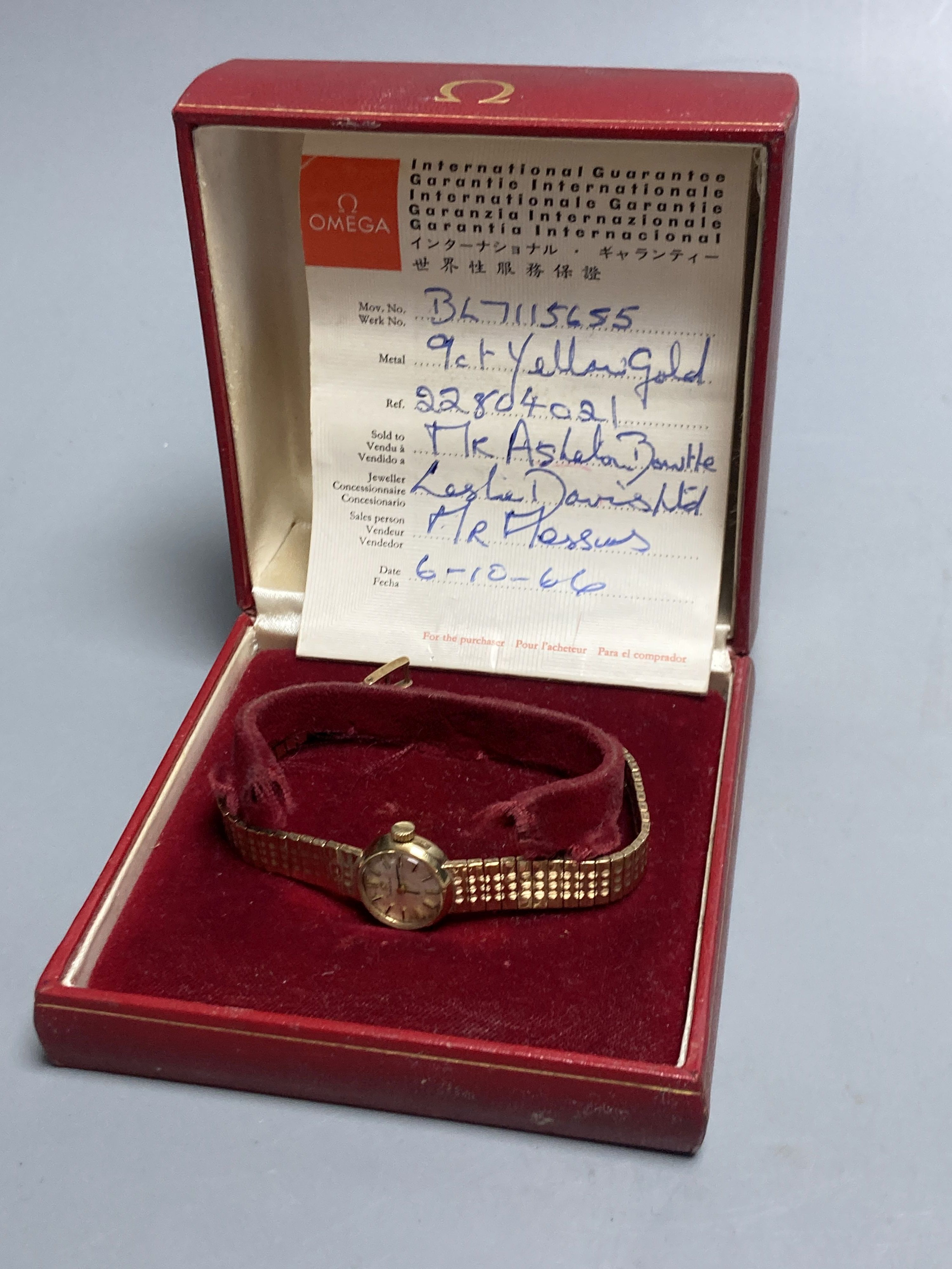 A ladys 1960s 9ct gold Omega manual wind wrist watch, on a 9ct gold Omega bracelet, overall length 18.5mm gross 21.3 grams,